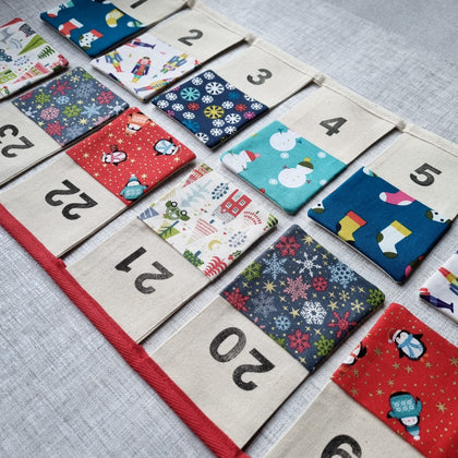 Reusable advent calendar bunting in red or blue 